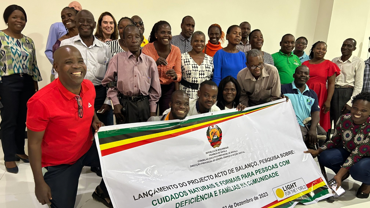 Attendees of the launch event in Mozambique pose for the camera.