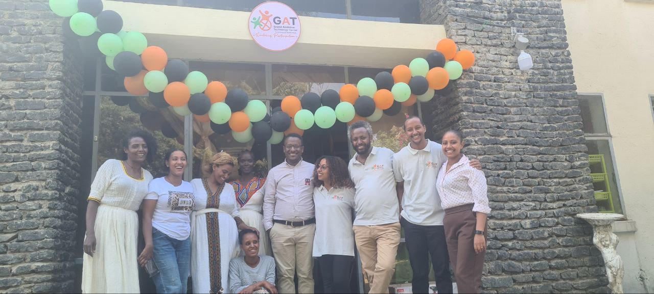 The team behind the Grand Assistive Technology (GAT) Center's inclusive early childhood care and development center pose for the camera 