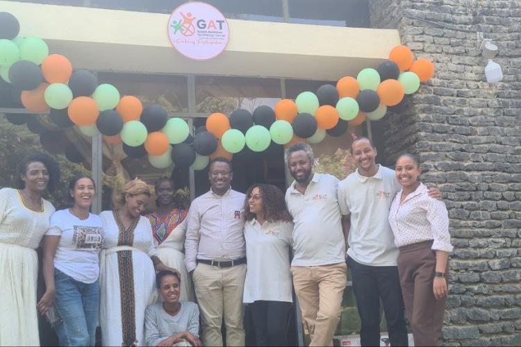 The team behind the Grand Assistive Technology (GAT) Center's inclusive early childhood care and development center pose for the camera 