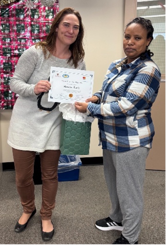 ICACBR Scientific Director Dr. Heather Aldersey presents award winner Meseret Ayele with her certificate